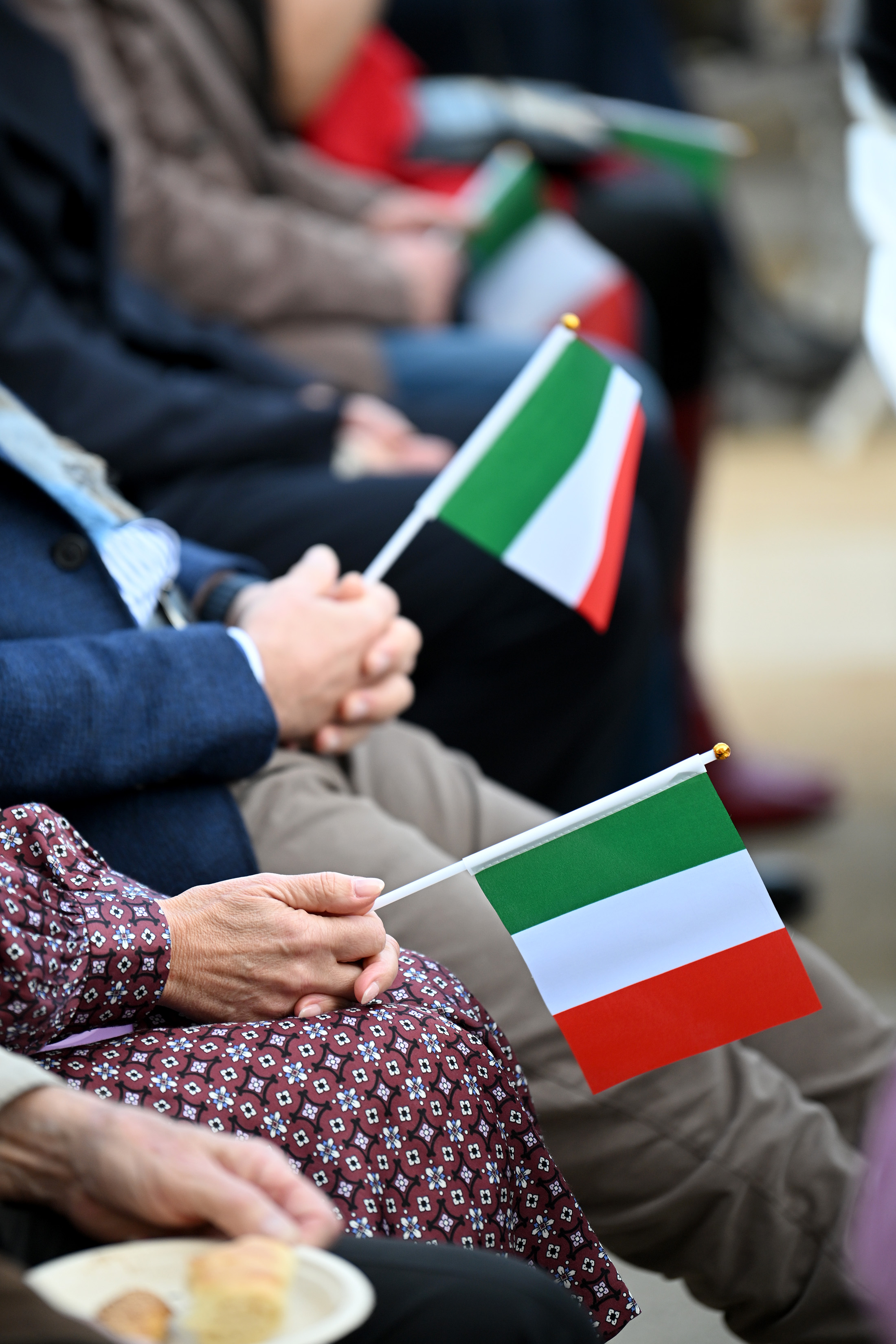 Officials and members of the public come together for a...