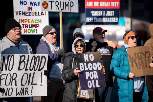 Protesters rally in front of the Ohio Statehouse in Columbus, Ohio