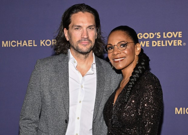 Audra McDonald, right, and Will Swenson attend the God's Love We Deliver Golden Heart Awards at The Cathedral Church of St. John The Divine on Monday, Oct. 20, 2025, in New York. (Photo by Evan Agostini/Invision/AP)