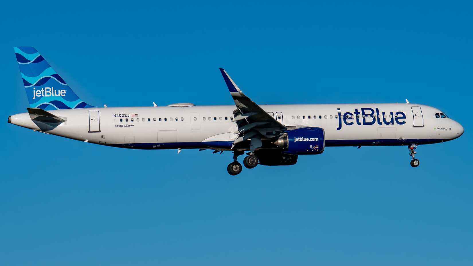 A JetBlue Airbus A321neo aircraft landing at Schipol Airport.