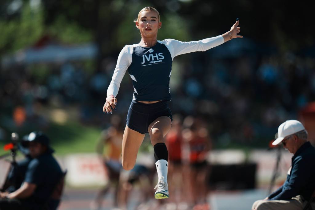 AB Hernandez, a transgender student, warms up before the long jump at the California high school track-and-field championships.