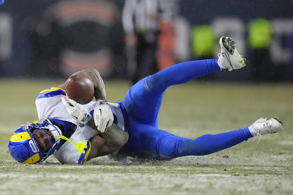 Los Angeles Rams safety Kam Curl makes an interception on a pass by Chicago Bears quarterback Caleb Williams, not visible, during overtime of an NFL football divisional playoff game Sunday, Jan. 18, 2026, in Chicago. (AP Photo/Jeff Roberson)