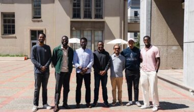 Seven men posing for a photo on the UC Berkeley College of Chemistry plaza