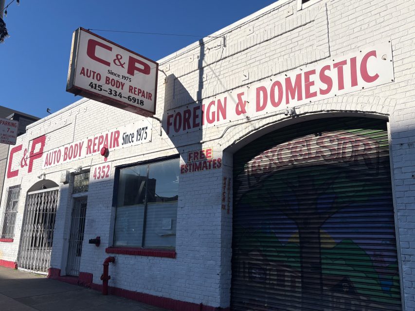 White brick auto body repair shop with red trim and signage reading "C&P Auto Body Repair, Foreign & Domestic, Free Estimates" and the address 4352.