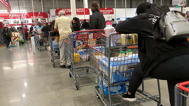 Shoppers at Costco in La Mesa faced long lines as people stocked up on supplies including toilet paper and water.
