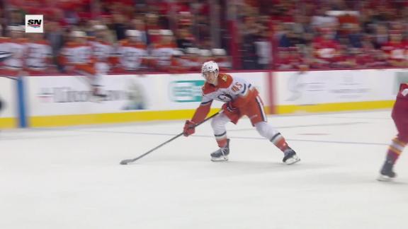 Sennecke scores in OT for 1st NHL hat trick as Ducks rally to beat Flames 4-3