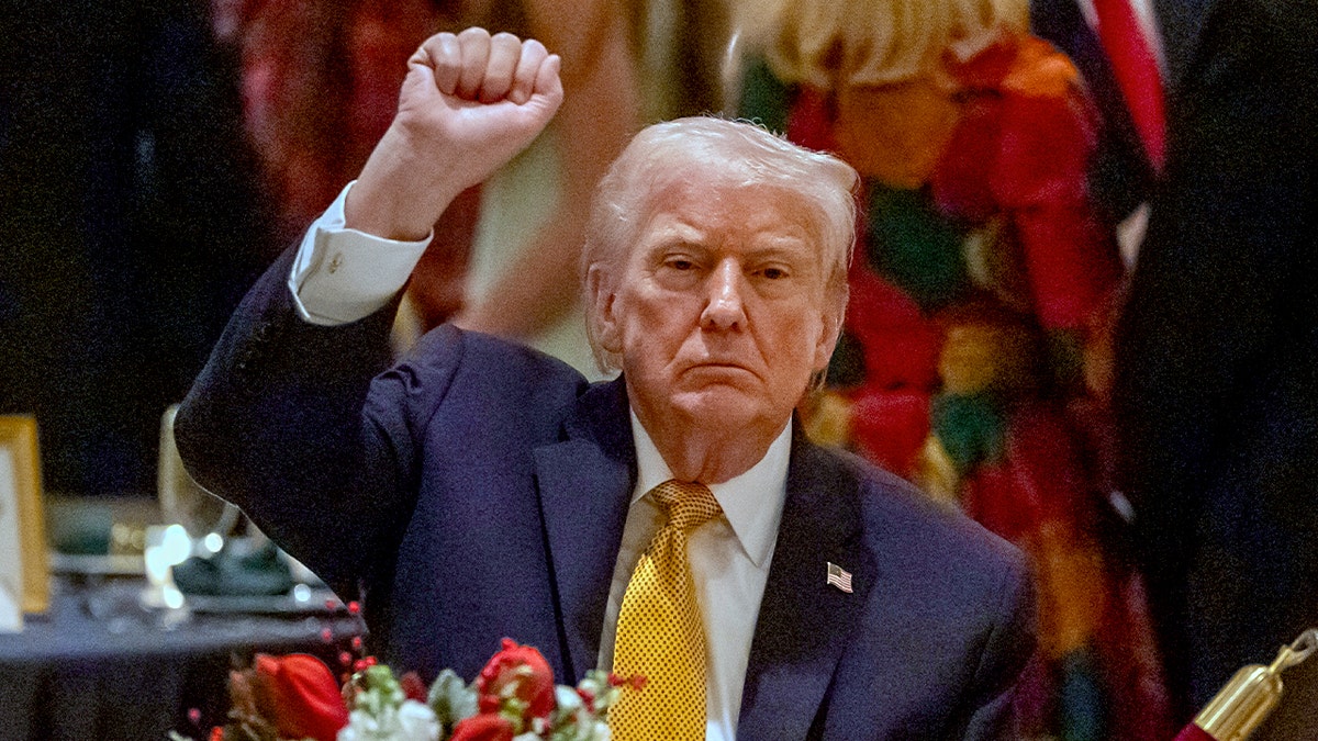 Trump holds up a fist