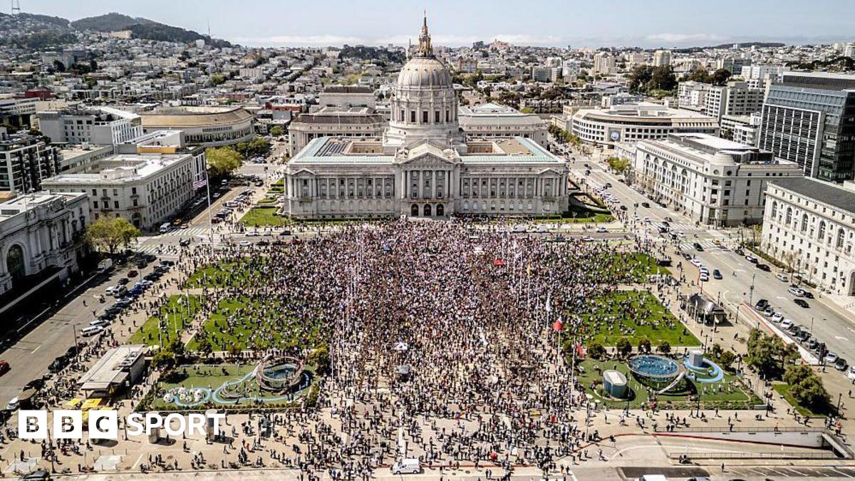 Crowds gather outside City Hall on the Civic Center Plaza in San Francisco