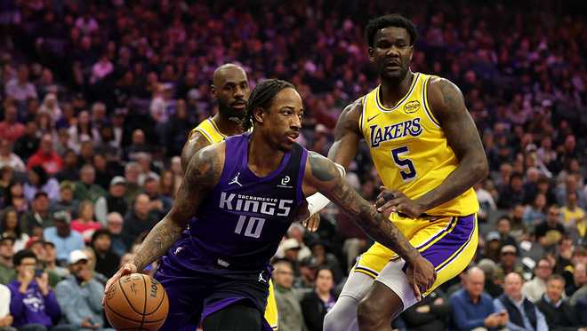 SACRAMENTO, CALIFORNIA - JANUARY 12: DeMar DeRozan #10 of the Sacramento Kings is guarded by Deandre Ayton #5 of the Los Angeles Lakers at Golden 1 Center on January 12, 2026 in Sacramento, California. NOTE TO USER: User expressly acknowledges and agrees that, by downloading and/or using this photograph, user is consenting to the terms and conditions of the Getty Images License Agreement. (Photo by Ezra Shaw/Getty Images)