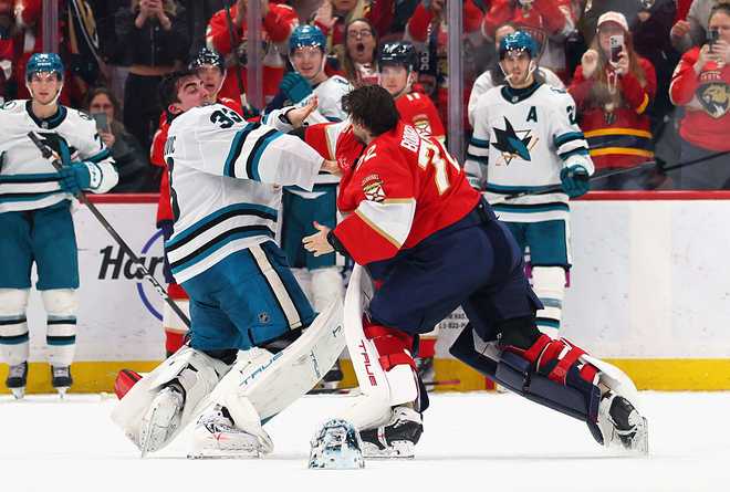 SUNRISE, FLORIDA - JANUARY 19: Alex Nedeljkovic #33 of thea San Jose Sharks and Sergei Bobrovsky #72 of the Florida Panthers fight during the third period at Amerant Bank Arena on January 19, 2026 in Sunrise, Florida. (Photo by Bruce Bennett/Getty Images)