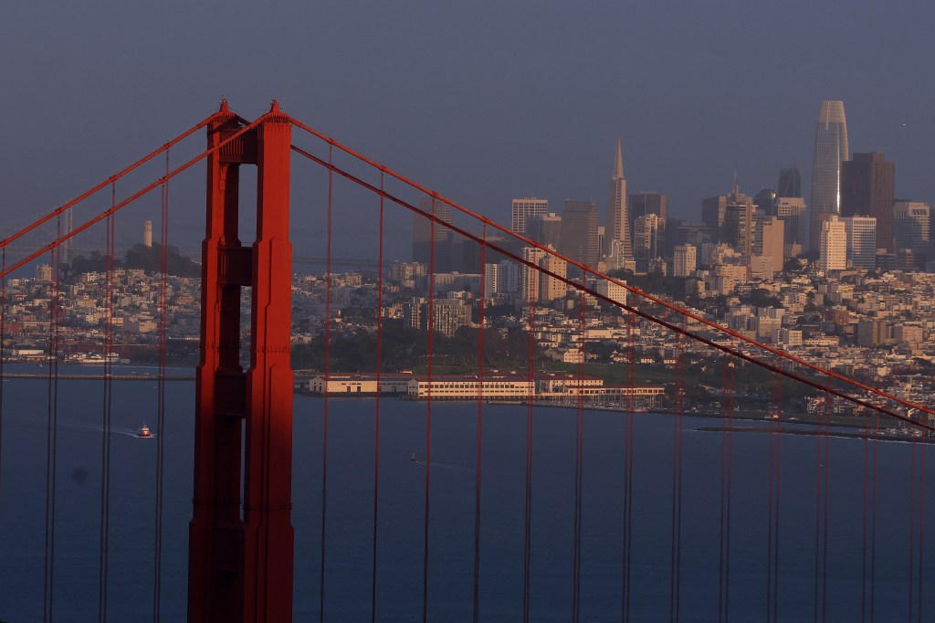 The Golden Gate Bridge with San Francisco's skyline in the background.
