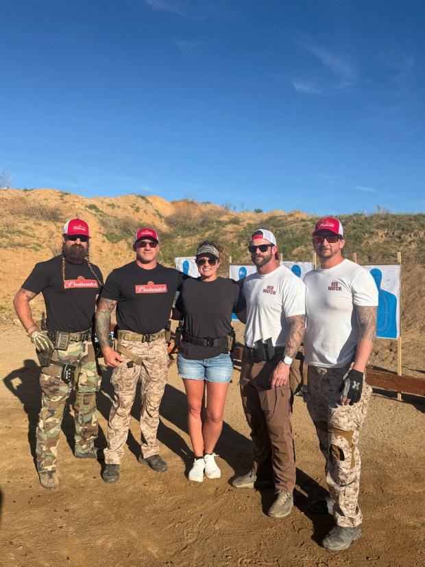 RedWatch Chief Training Officer Johnny Collins, Chief Executive Officer Dave Swarts, firearms training student Stephanie Ogilvie, Chief Operating Officer Tim Speer, and RedWatch Director of Brand and Strategic Marketing Derek Janisch at the January 17 All-Women's Pistol Training Course. (Courtesy RedWatch) 