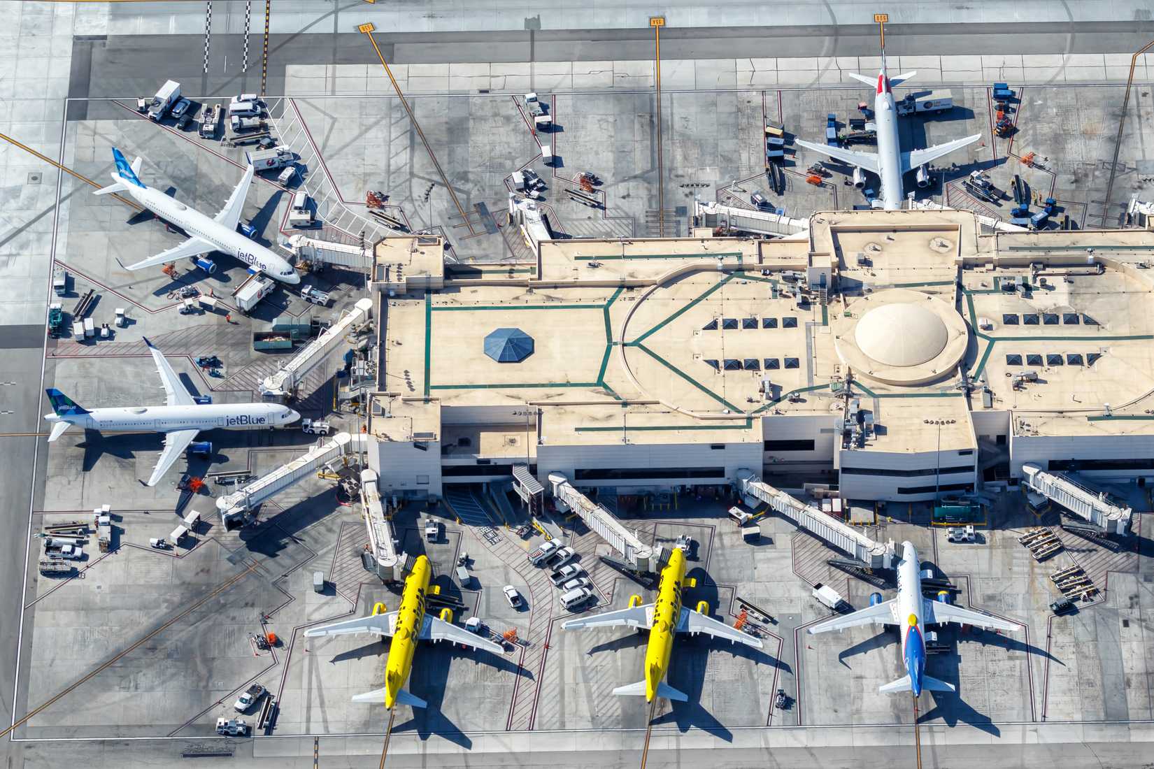 irplanes from jetBlue and Spirit Airlines at Los Angeles Airport (LAX) aerial view in the United States.