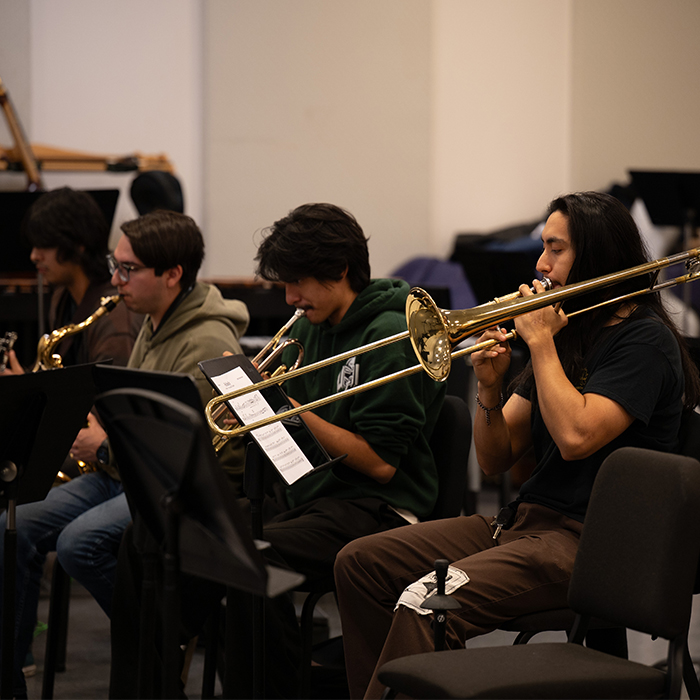 three Jazz combo musicians including a trombone player