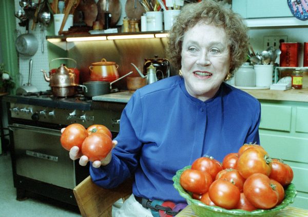 Chef and author Julia Child works in the kitchen at her home in Cambridge, Mass., in 1992. (Jon Chase / AP file)