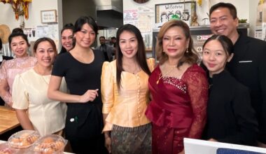 people posing in a restaurant space