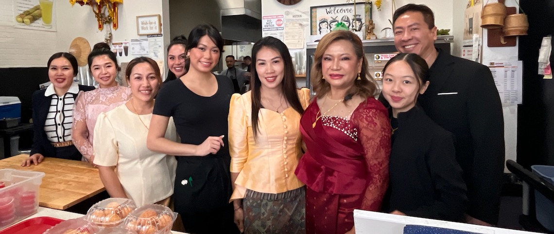 people posing in a restaurant space