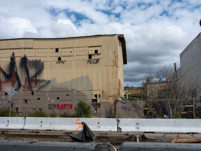 A vacant and graffiti-covered warehouse building