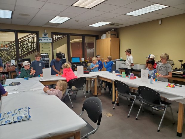 Members of the speed cubing club based at La Jolla Elementary School gather at the La Jolla/Riford Library. (Ashley Mackin-Solomon)
