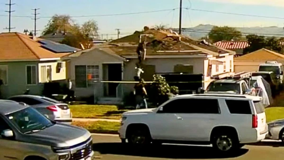 Individuals flee across rooftops during a U.S. Border Patrol enforcement operation in Montebello, California.