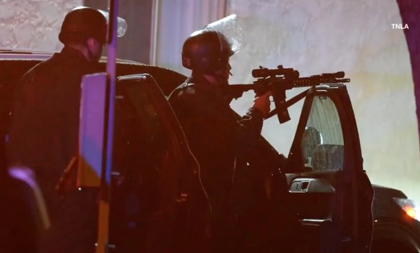 Police officer with a rifle.