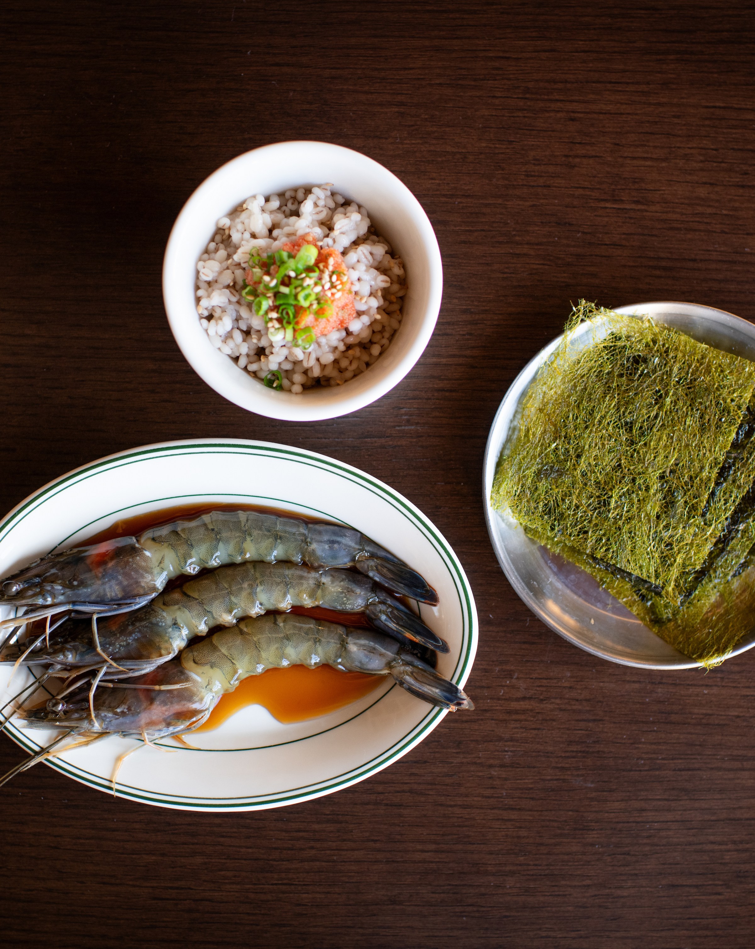 Soy-marinated blue prawns with pollack roe over barley rice and Gamte seaweed.