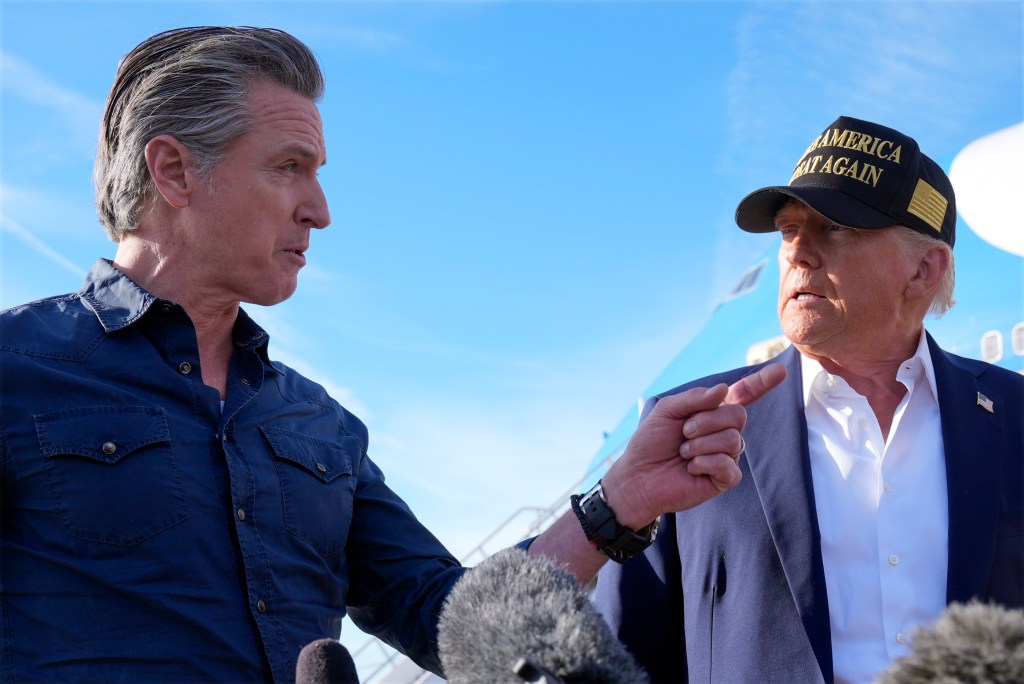 President Trump and California Governor Gavin Newsom interacting on an airport tarmac.