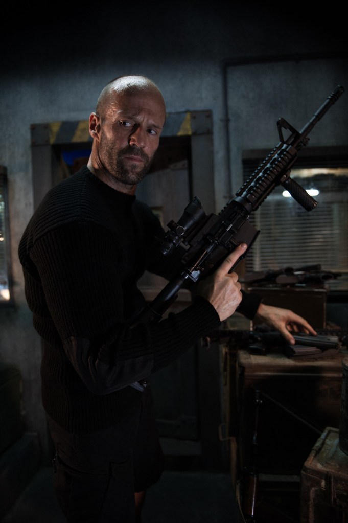 Jason Statham holding a rifle in "Mechanic: Resurrection".