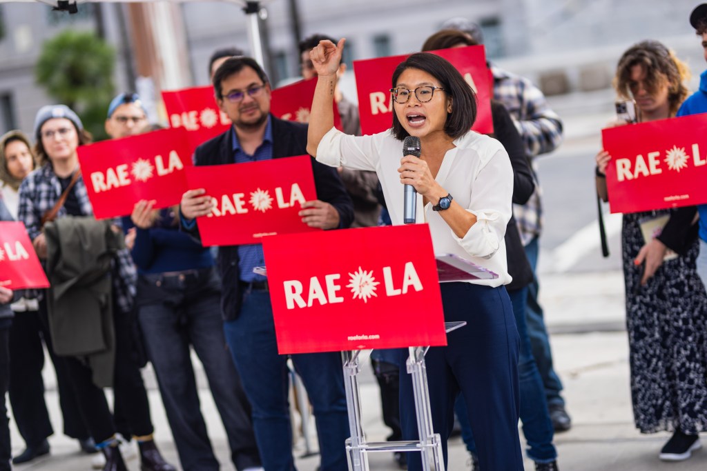 Reverend Rae Huang announcing her mayoral campaign at a press conference in front of City Hall in Los Angeles.
