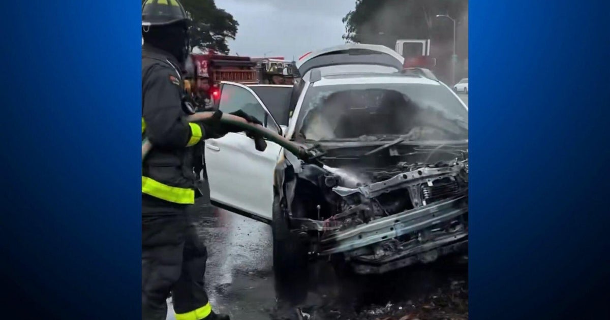 San Francisco firefighters rescue occupants from burning vehicle