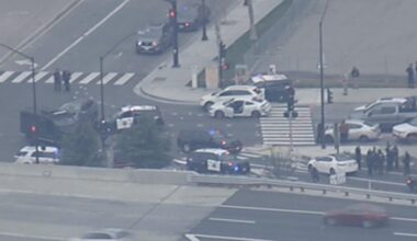 San Jose police say an officer was shot following a carjacking