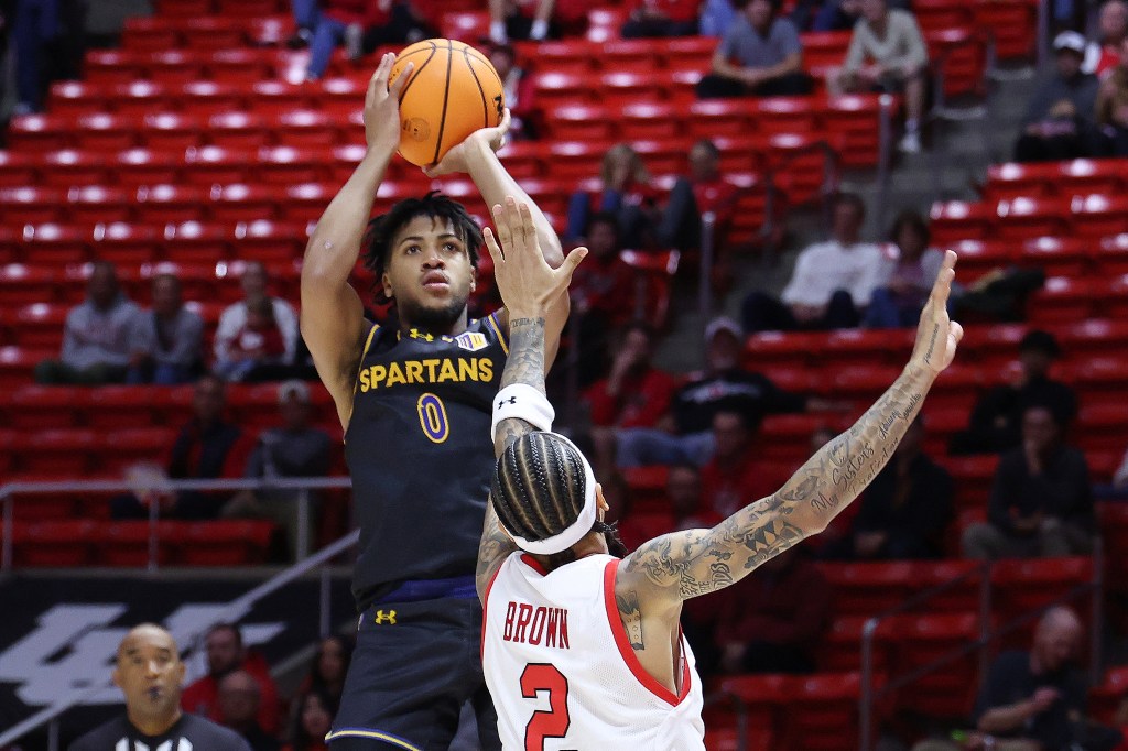 San Jose State's Colby Garland shooting over Utah's Terrence Brown.