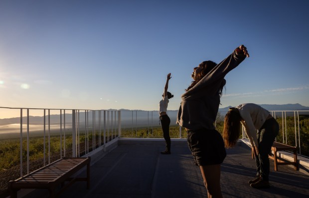 Several employees with the San Diego Natural History Museum start the day doing a sunrise yoga session at the Sierra de las Cacachilas on Tuesday, Oct. 28, 2025. (Ana Ramirez / The San Diego Union-Tribune)