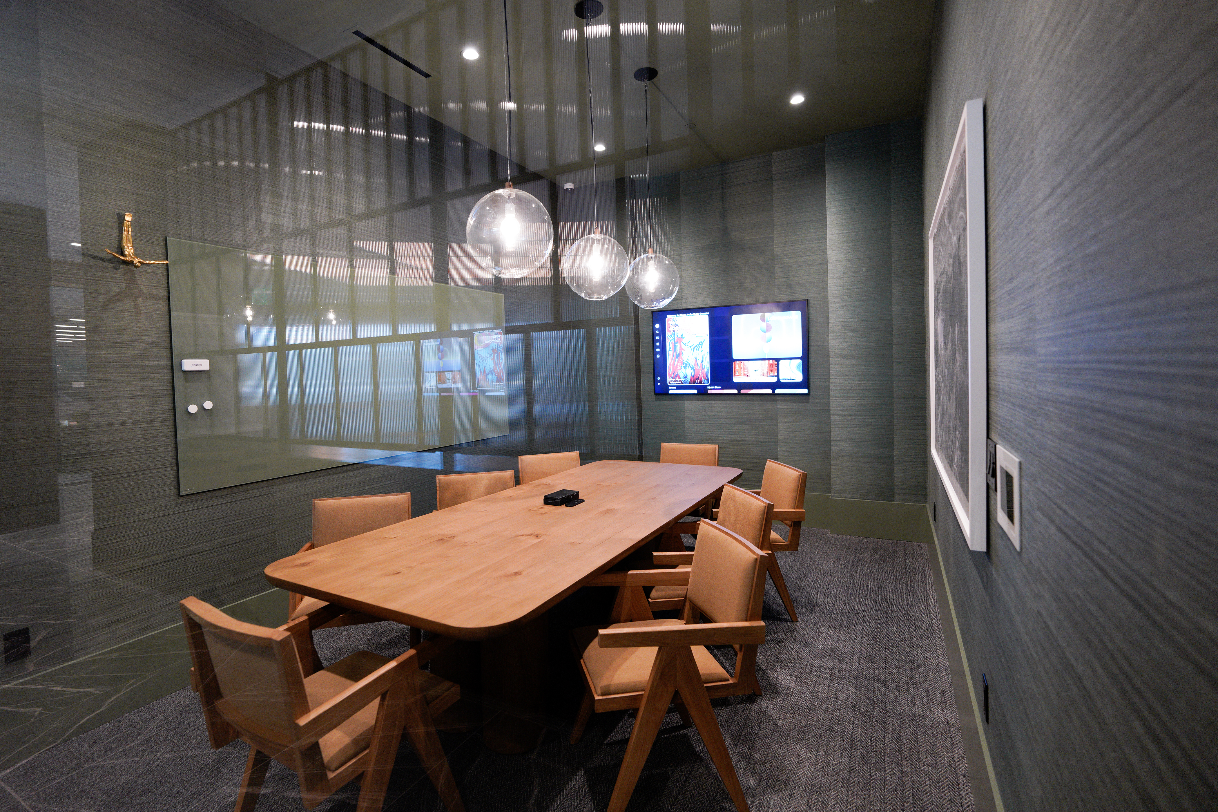 A conference room at new apartment building Alexan Camellia near...