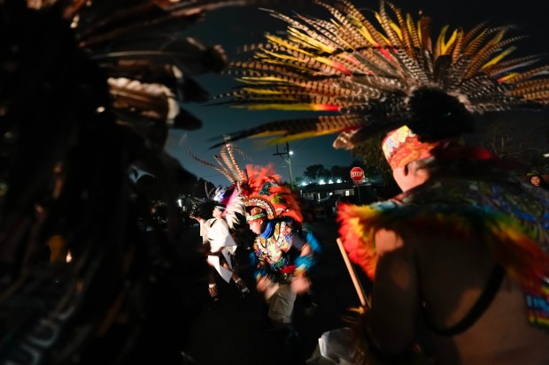 Aztec dancers perform on Osborn Street for residents of the Southcrest Community on Thursday, Jan. 22, 2026 in San Diego, CA. (Nelvin C. Cepeda / The San Diego Union-Tribune)