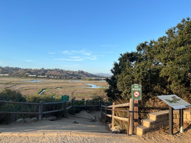 The trailhead leading into the San Elijo Lagoon Ecological Reserve at North Rios Avenue. (Maura Fox / The San Diego Union-Tribune)