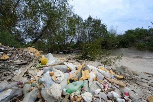 Trash debris left from the last rain storm in San Diego. At the moment the riverbed is dry and littered with garbage from the recent rains. During the rainy season, the steady flowing stream and trash debris feed into the Tijuana River Valley.  It is located off Monument Road along the U.S.-Mexico border in San Diego, CA.  (Nelvin C. Cepeda / The San Diego Union-Tribune)