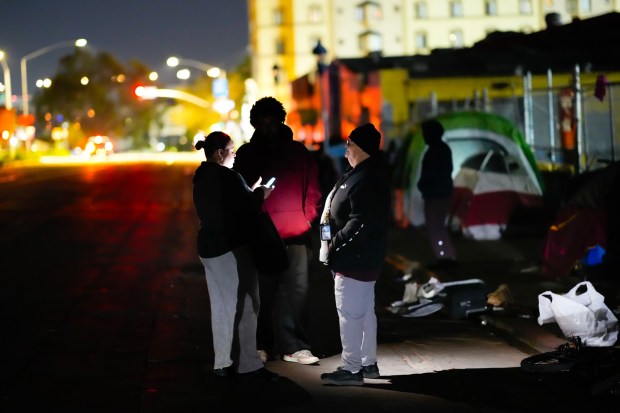 Carmen Jimenez (l) and Ruth Clerico (r) interview several people on 17th Street in downtown East Village on Thursday, Jan. 29, 2026, in San Diego, CA.  The ladies were taking part in the annual Point-in-Time Count of people experiencing homelessness in San Diego County. (Nelvin C. Cepeda / The San Diego Union-Tribune)