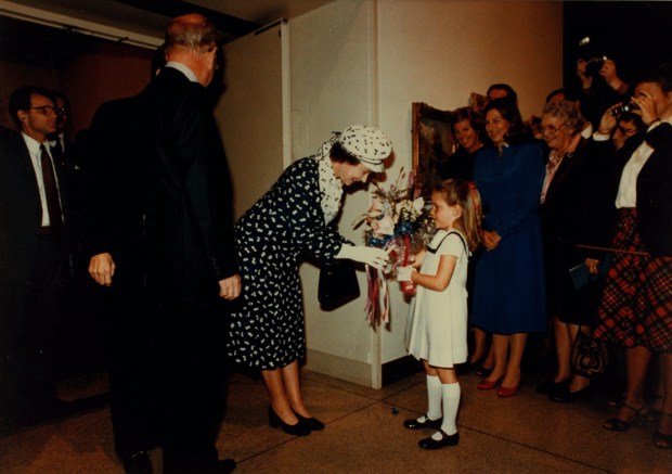 Qheen Elizabeth II accepts a bouquet during her visit to the San Diego Museum of Art in 1983. (SDMA Archives)