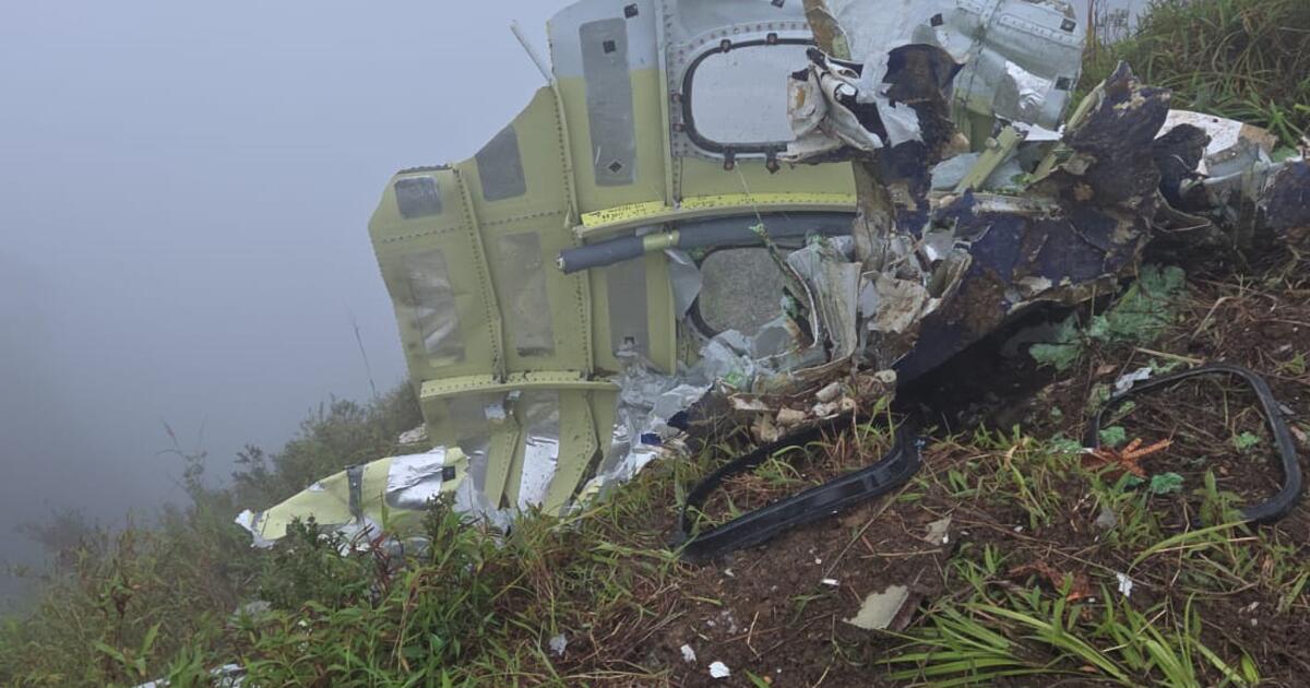 Indonesian rescuers find a body near plane wreckage