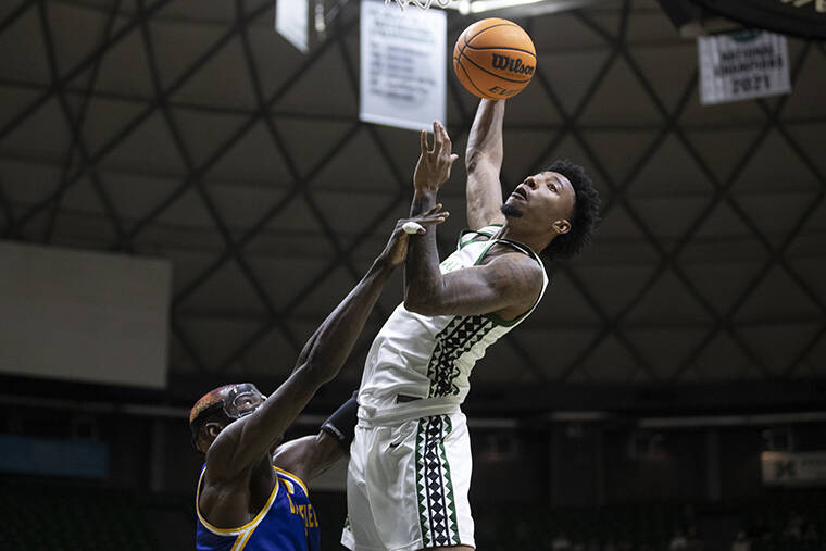GEORGE F. LEE / GLEE@STARADVERTISER.COM
                                Hawaii Rainbow Warriors Dre Bullock opened the game with a dunk against Bakersfield Roadrunners Pierre Geneste Jr. during a Big West mens basketball game at the Bankoh Arena, Stan Sheriff Center.