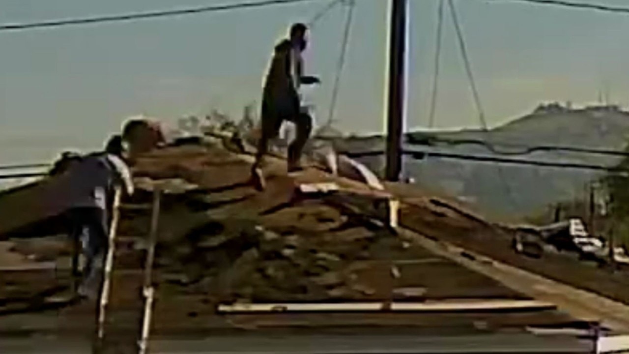 Workers jump across roofs during ICE raid