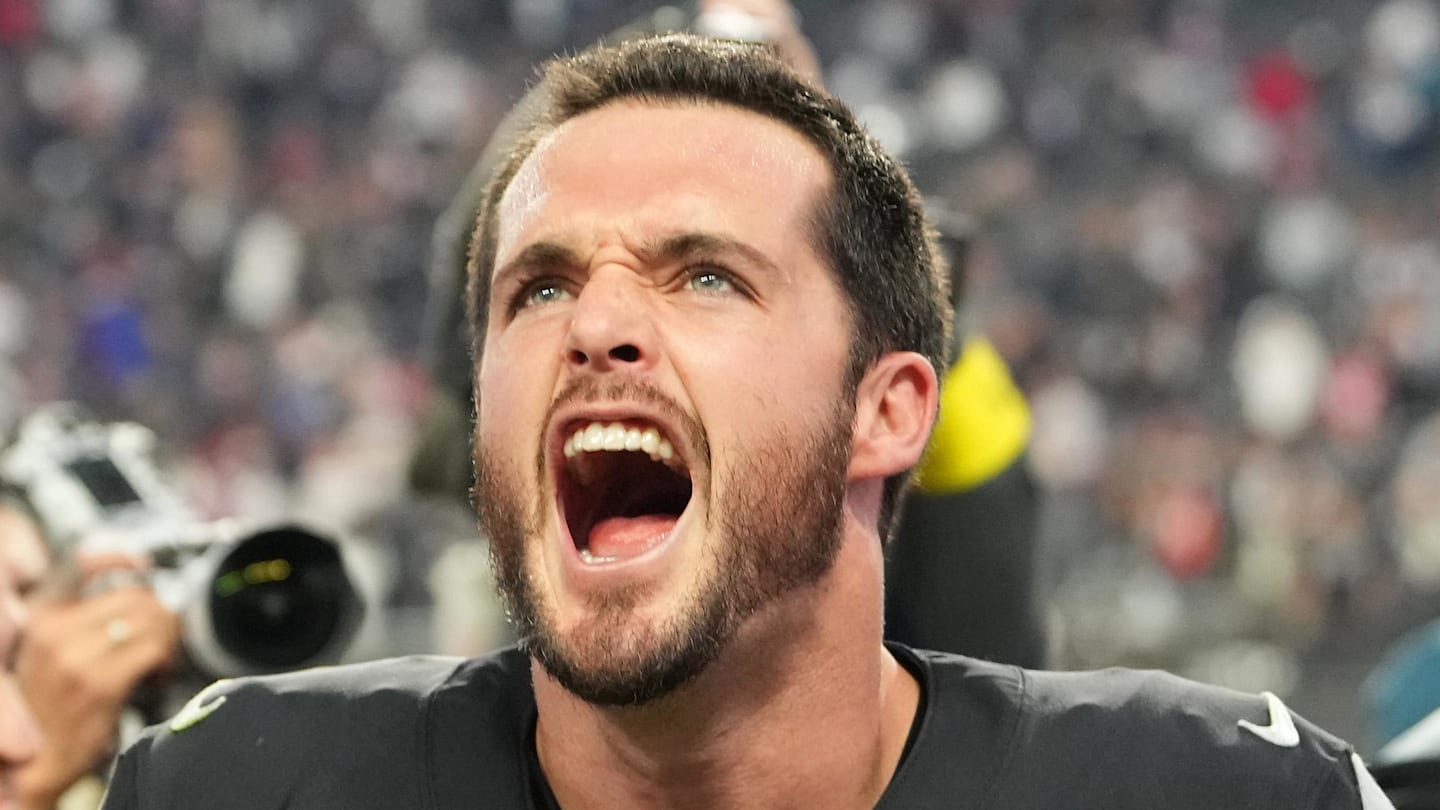 Dec 18, 2022; Paradise, Nevada, USA; Las Vegas Raiders quarterback Derek Carr (4) and Raiders head coach Josh McDaniels celebrate after the Raiders defeated the New England Patriots 30-24 at Allegiant Stadium. Mandatory Credit: Stephen R. Sylvanie-Imagn Images