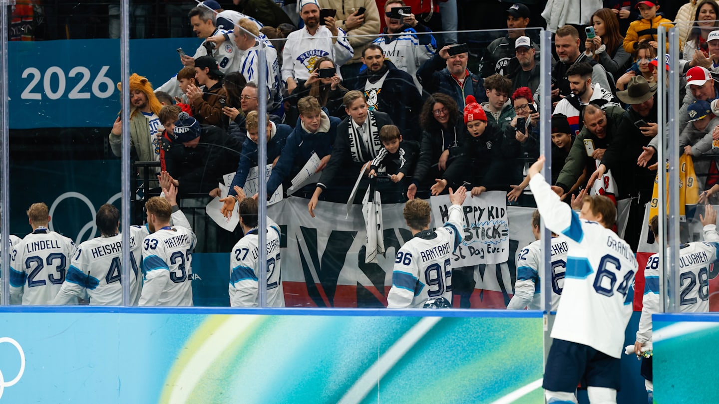 Feb 21, 2026; Milan, Italy; Finland celebrate with fans after the men's ice hockey bronze medal game during the Milano Cortina 2026 Olympic Winter Games at Milano Santagiulia Ice Hockey Arena. Mandatory Credit: Geoff Burke-Imagn Images