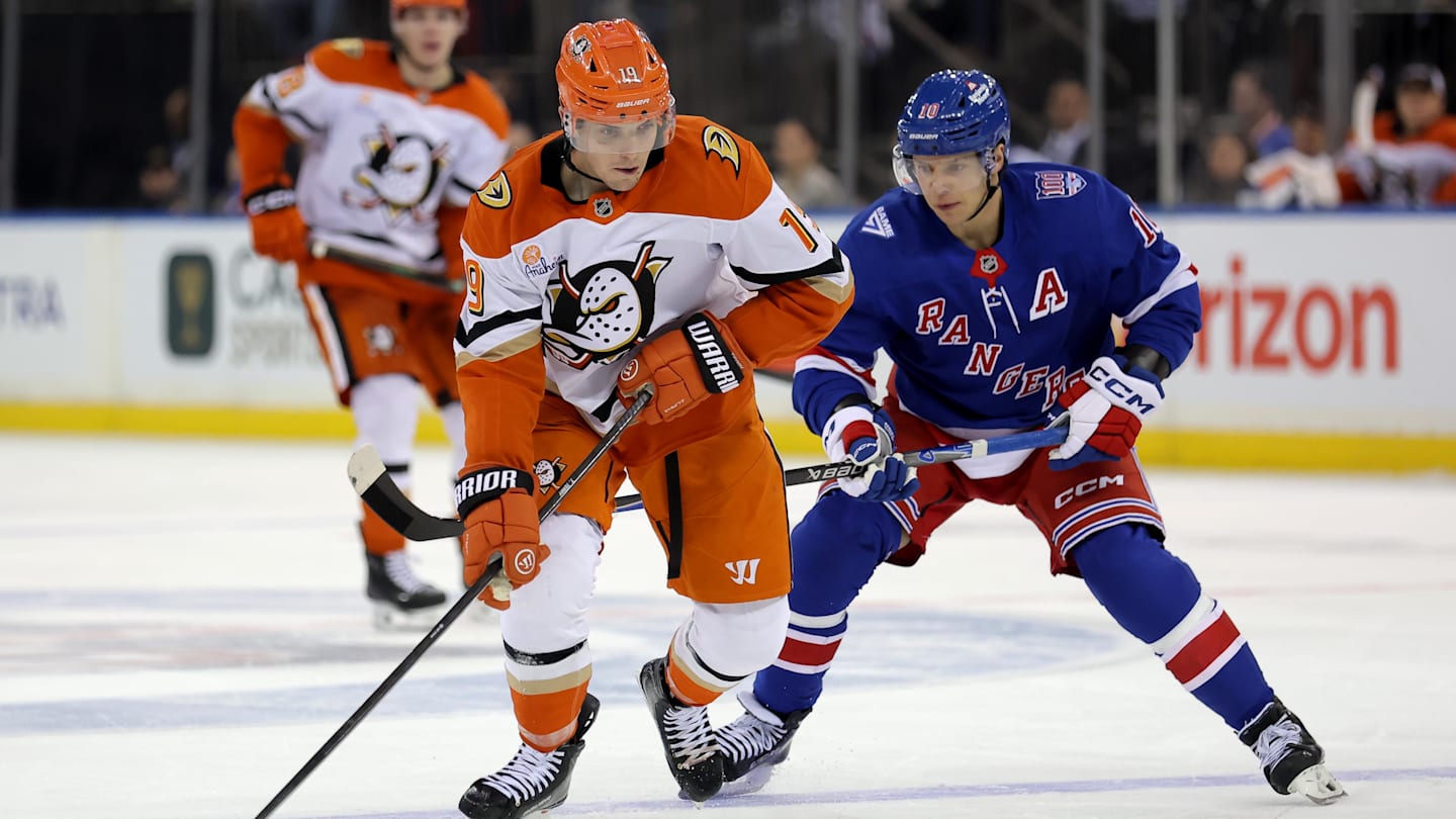 Dec 15, 2025; New York, New York, USA; Anaheim Ducks right wing Troy Terry (19) skates with the puck against New York Rangers left wing Artemi Panarin (10) during the third period at Madison Square Garden. Mandatory Credit: Brad Penner-Imagn Images