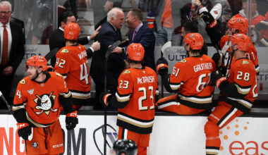 Feb 25, 2026; Anaheim, California, USA;  Anaheim Ducks head coach Joel Quenneville (back row, middle) celebrates with his coaching staff and players after winning his 1,000th career coaching victory with a 6-5 win over the Edmonton Oilers at Honda Center. Mandatory Credit: Kiyoshi Mio-Imagn Images