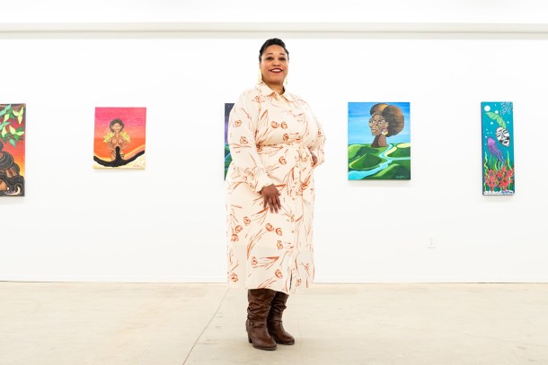 Delgreta Brown in the center of Axis Gallery exhibition space with her work, “Gardens of Huemanity,” hangs around, Feb. 9. Louis Bryant III OBSERVER