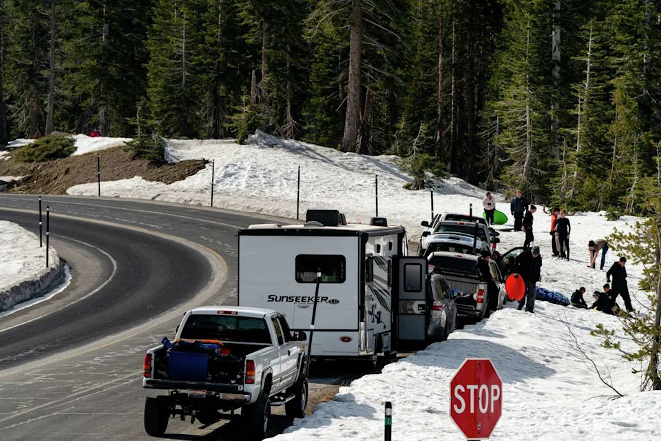 Cars belonging to visiting families line a roadside pullout on Highway 4 near Round Valley and Lake Alpine Sno-Parks in Alpine County. (Louis Bryant III/For the S.F. Chronicle)