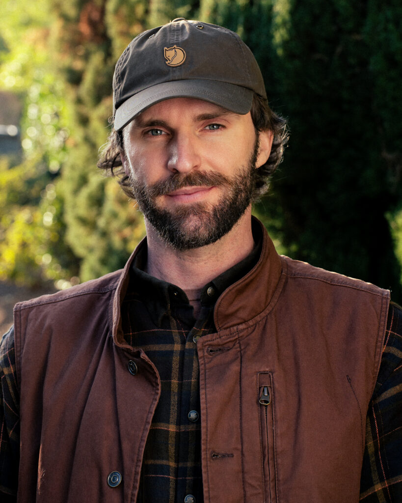 A photo of a scientist standing outside