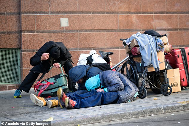 AT&T and nearly 100 other stores closed locations in San Francisco's Union Square neighborhood in 2023 due to rampant homelessness and crime. Some homeless people in the city are pictured